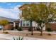 Charming two-story home boasting well-maintained landscaping and an inviting front entrance at 14175 W Bronco Trl, Surprise, AZ 85387