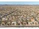 Aerial view of neighborhood with desert landscaping, tiled roofs, mountain views, and nearby highway at 14218 W Via Montoya --, Sun City West, AZ 85375