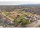Wide aerial view of the golf course community, showcasing the clubhouse, cart paths, and residential area at 14218 W Via Montoya --, Sun City West, AZ 85375