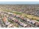 Aerial view of the community with a golf course nearby showcasing manicured green fairways at 14218 W Via Montoya --, Sun City West, AZ 85375