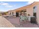 Inviting backyard patio with seating, barbecue, and landscaped yard at 14218 W Via Montoya --, Sun City West, AZ 85375