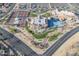 Spectacular aerial view of the community's clubhouse, pool, tennis courts, manicured grounds, and ample parking at 14218 W Via Montoya --, Sun City West, AZ 85375