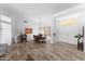 Inviting dining room with hardwood floors, stylish lighting, and ample seating for Gathering and guests at 14218 W Via Montoya --, Sun City West, AZ 85375