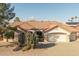 Charming front exterior featuring a desert landscape and attached garage at 14218 W Via Montoya --, Sun City West, AZ 85375