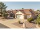 Well-maintained home with mature landscaping, three car garage, and desert-style yard at 14218 W Via Montoya --, Sun City West, AZ 85375