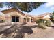 Attractive single-story home featuring a well-maintained yard with desert landscaping and a terracotta tile roof at 14218 W Via Montoya --, Sun City West, AZ 85375