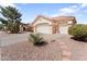 Charming home with a two-car garage and desert landscaping with a tiled roof at 14218 W Via Montoya --, Sun City West, AZ 85375