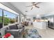 Open concept living and dining area featuring a large window and updated kitchen with stainless steel appliances at 14218 W Via Montoya --, Sun City West, AZ 85375