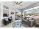 Comfortable living room with light hardwood floors, contemporary decor, and sliding doors to the patio at 14218 W Via Montoya --, Sun City West, AZ 85375