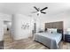 Spacious main bedroom features wood-look floors, closet, and ensuite bath at 14218 W Via Montoya --, Sun City West, AZ 85375