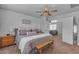 Spacious bedroom showcases a comfortable bed, shiplap wall, and cozy decor at 14875 W Larkspur Dr, Surprise, AZ 85379