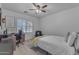 Bright bedroom with a window and neutral decor at 14875 W Larkspur Dr, Surprise, AZ 85379