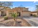 Charming two-story home with an attached garage and low-maintenance desert landscaping at 14875 W Larkspur Dr, Surprise, AZ 85379