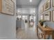Hallway with a view to the dining and living area at 14875 W Larkspur Dr, Surprise, AZ 85379