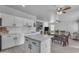 Bright kitchen with stylish island flows into the dining area and a spacious living room at 14875 W Larkspur Dr, Surprise, AZ 85379