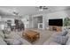 Inviting open-concept home featuring a spacious living room and connected dining and kitchen areas at 14875 W Larkspur Dr, Surprise, AZ 85379