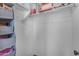 White walk-in closet has ample space for storage and organization at 14875 W Larkspur Dr, Surprise, AZ 85379