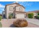 Attractive two-story home featuring a well-maintained lawn and a two-car garage at 1493 S Western Skies Dr, Gilbert, AZ 85296