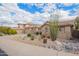 Charming single-story home featuring a three-car garage and desert landscaping at 15015 E Vermillion Dr, Fountain Hills, AZ 85268