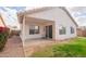 Backyard with a covered patio and well-kept lawn and landscaping at 1502 E Detroit St, Chandler, AZ 85225