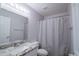 Full bathroom with granite countertops, modern fixtures, and a shower with a white curtain at 1502 E Detroit St, Chandler, AZ 85225