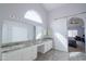 Bathroom featuring a double sink, granite countertops, a sliding door, and ample natural light at 1502 E Detroit St, Chandler, AZ 85225