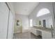 Bright bathroom featuring a large mirror, granite countertops, and a separate shower and bathtub at 1502 E Detroit St, Chandler, AZ 85225