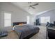 Spacious bedroom with vaulted ceilings, ceiling fan, and ample natural light from multiple windows at 1502 E Detroit St, Chandler, AZ 85225