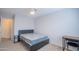 Bedroom with neutral carpet, a ceiling fan, and minimal furnishings, ready for personalization at 1502 E Detroit St, Chandler, AZ 85225