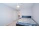 Bedroom with neutral carpet, a ceiling fan, a closet, and minimal furnishings at 1502 E Detroit St, Chandler, AZ 85225