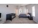 Bright bedroom with neutral walls, ceiling fan, and lots of space for crib and bed at 1502 E Detroit St, Chandler, AZ 85225