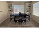 Dining area showcases a large window with built-in bookcases and a dining table at 1502 E Detroit St, Chandler, AZ 85225