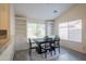 Inviting dining area features contemporary furnishings and built-in shelving and a window with a view at 1502 E Detroit St, Chandler, AZ 85225