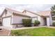 Exterior shot shows well-manicured lawn and neutral-colored exterior, complemented by desert landscaping at 1502 E Detroit St, Chandler, AZ 85225
