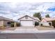 Charming single-story home features a two-car garage, low maintenance yard, and classic desert landscaping at 1502 E Detroit St, Chandler, AZ 85225