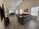 Bright living room features vaulted ceiling, modern gray sofa, and wood-style tile flooring at 1502 E Detroit St, Chandler, AZ 85225