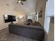 Open-concept living room with a comfortable gray sectional sofa and view of kitchen at 1502 E Detroit St, Chandler, AZ 85225