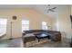 Open living room with vaulted ceilings, large windows, and modern gray sectional sofa at 1502 E Detroit St, Chandler, AZ 85225