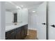 Bathroom featuring a modern vanity with gold fixtures and a walk-in shower at 16215 N 35Th Pl, Phoenix, AZ 85032