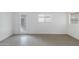 Bright bedroom featuring three large windows and tiled flooring at 16215 N 35Th Pl, Phoenix, AZ 85032