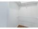 Walk-in closet with wood-look floors and built-in shelving and rods, offering ample storage at 16215 N 35Th Pl, Phoenix, AZ 85032
