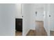Hallway view featuring modern vanity with dark wood cabinet and updated lighting at 16215 N 35Th Pl, Phoenix, AZ 85032