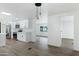 Well-lit kitchen featuring stainless steel appliances, white cabinetry, and breakfast bar at 16215 N 35Th Pl, Phoenix, AZ 85032