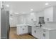 Modern kitchen featuring white cabinets and stainless steel appliances at 16215 N 35Th Pl, Phoenix, AZ 85032