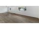 Bright and airy living room offering new flooring and neutral paint at 16215 N 35Th Pl, Phoenix, AZ 85032