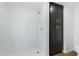 Walk-in shower featuring a cabinet with gold fixtures, a modern shower head and clean white tile at 16215 N 35Th Pl, Phoenix, AZ 85032