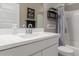 Bright bathroom with modern fixtures, white cabinets, and a shower-tub combination at 17017 N Palo Azul Rd, Maricopa, AZ 85138