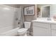 Stylish bathroom with modern fixtures, white cabinets, and a shower-tub combination at 17017 N Palo Azul Rd, Maricopa, AZ 85138