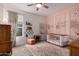 Charming Bedroom with painted walls and a ceiling fan, a cozy haven for your little one at 17017 N Palo Azul Rd, Maricopa, AZ 85138