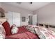 Comfortable bedroom with a ceiling fan, closet, and neutral color, creating a relaxing atmosphere at 17017 N Palo Azul Rd, Maricopa, AZ 85138